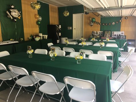 Graduation party in garage Gold And Green Graduation Party, Graduation Garage Party Ideas, Green Gold Graduation Party, Graduation Party Garage Set Up, Garage Graduation Party, Graduation Party Ideas Green, Indoor Grad Party, Party In Garage, Garage Decorating Ideas For Party