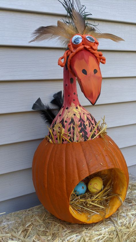 This #bird #pumpkin is easy to make with 2 pumpkins, a few feathers, acrylic paint, a couple of googly eyes, some paper, a piece of cardboard, three Easter eggs and a hot glue gun. Pumpkin Bird, Bird Pumpkin, Story Book Pumpkin, Chicken Pumpkin, Pumpkin Ideas, Googly Eyes, Painted Pumpkins, Hot Glue Gun, Glue Gun