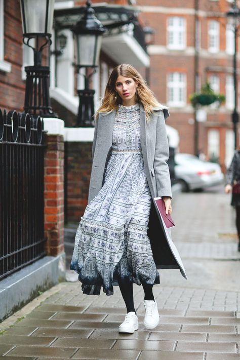 That peasant dress hiding in the back of your closet? Give it new life with tights, sneakers, and a gray overcoat. #refinery29 http://www.refinery29.com/2016/02/103453/london-fashion-week-fall-winter-2016-street-style-pictures#slide-67 Street Style 2016, Winter Outfits Cold, Winter Mode, Womens Fashion Casual Summer, London Street Style, Street Style Winter, Outfit Trends, London Street, Fashion Over 40