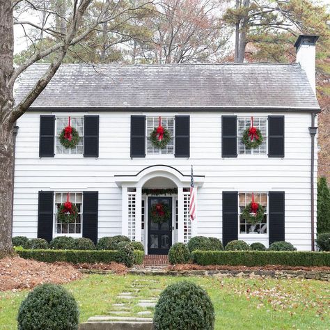 Christmas Wreaths On Windows, Wreaths On Windows, White Colonial House, Christmas Wreaths For Windows, Colonial Revival House, White Colonial, Colonial House Exteriors, Window Wreath, Black Shutters