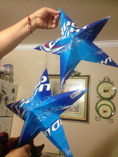 These are stars made from Bud Light cartons Beer Box Decorations, Coors Light Party Ideas, Beer Themed Christmas Decorations, Budweiser Party Decorations, Bud Light Party Theme, Busch Light Themed Party, Budlight Party Ideas, Dad Party Theme, Bud Light Birthday