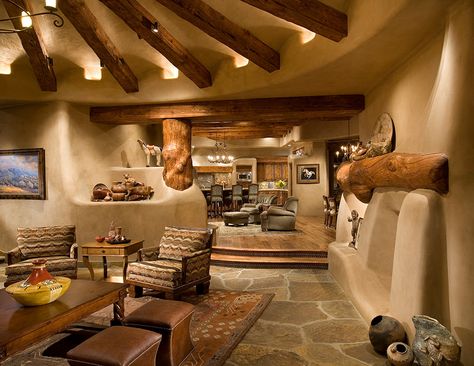 southwest-home-design-with-solid-color-ottomans-living-room-southwestern-and-arizona Southwest Interior, Southwestern Living Room, Southwest Living, Cob Building, Rustic Ceiling Lights, Earthship Home, Living Room Decor Rustic, Adobe House, Interior Design Rustic