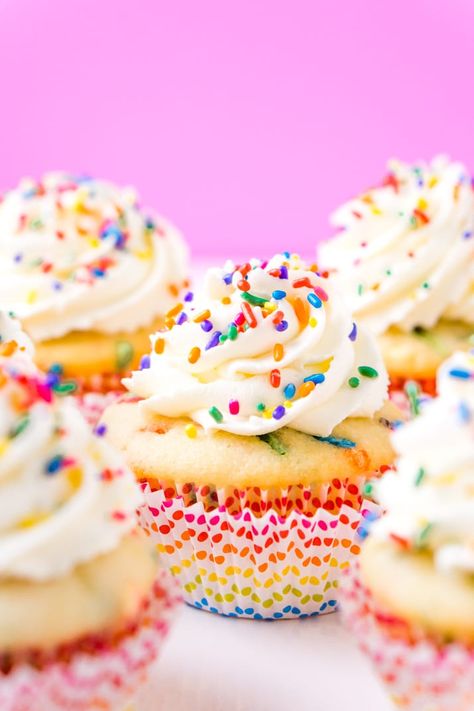 These Birthday Cupcakes are a delicious and fluffy vanilla almond cake that's loaded with sprinkles and topped with an easy and addictive whipped frosting! Vanilla Almond Cake, Best Vanilla Cupcake Recipe, Chocolate Buttercream Frosting Recipe, Donut Cupcakes, Rainbow Desserts, Funfetti Cupcakes, Cupcake Decorating Tips, Vanilla Cupcake Recipe, Whipped Frosting