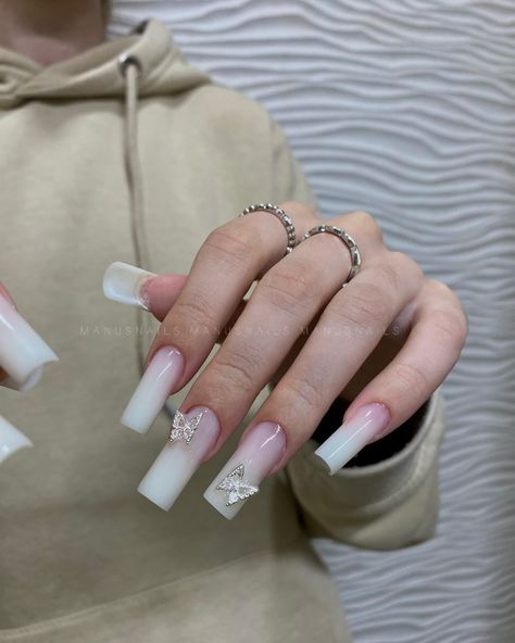 Butterfly charm nails🦋🤍 #butterflycharmnails #butterflynails #charmnails #milkywhitenails White Nails W Butterflies, Milky Nails With Butterflies, Nail Designs With Butterfly Charms, Gel X Nails With Charms, Nails With Butterflies Charm, Nails Inspiration Butterfly, Nails With Butterfly Charms, Charms On Nails, Butterfly Charm Nails