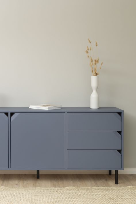 This blue sideboard from our Corner collection has plenty of storage. It is easy to place in many rooms, such as the living room or kitchen. For example, store your tableware and other kitchen items in the sideboard. The unique design with sophisticated handles in the form of bevelled and cut corners makes the furniture easily placed in all homes. Blue Sideboards, Kitchen Items, Sideboard, Unique Design, Handles, Unique Designs, Living Room, Tableware, Furniture