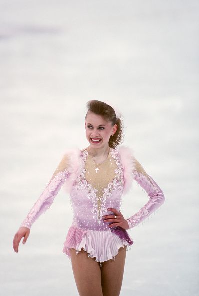 1994 Olympics - Women's Figure Skating LILLEHAMMER, NORWAY - FEBRUARY 25: Oksana Baiul of the Ukraine (UKR) competes in the Free Skate portion of the Women's Figure Skating singles competition of the 1994 Winter Olympic Games on February 25, 1994 at the Hamar Olympic Amphitheatre in Lillehammer, 90s Figure Skating Outfits, 90s Figure Skating, Olympic Skating, Figure Skating Hair, Oksana Baiul, Lillehammer Norway, Kurt Browning, Dust Bunny, Ice Skating Costumes