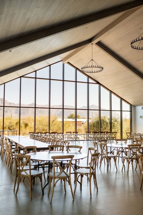 Indoor ceremony space with large window facing the Superstition Mountains, at Desert View Weddings and Events, a wedding venue in Apache Junction Arizona Wedding Ceremony Pavilion, Glass Event Space, The Paseo Venue Arizona, Event Center Design, Event Halls, Barn Venue Ideas, Venue Design Ideas, Modern Event Space, Wedding Venue Design