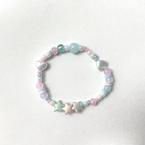 any lover album enthusiasts here? 🩵🤍🎀 #bracelets #beadedbracelets #taylorswiftbracelet #loverbracelet Lovers Bracelet, Bead Charms Diy, Bracelets Handmade Beaded, Bracelet Designs, Handmade Bracelets, Bead Charms, Beaded Jewelry, Beads, Design