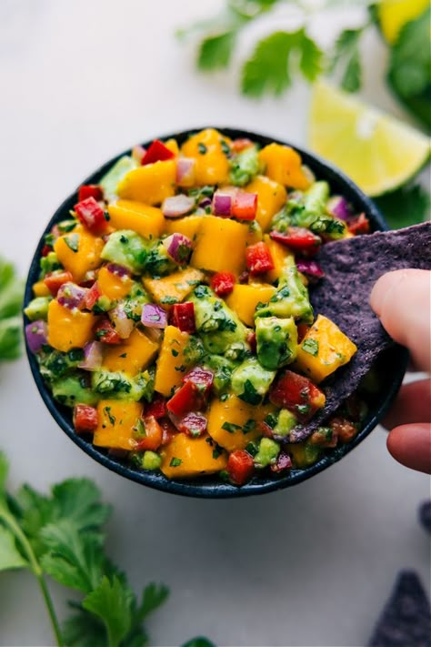 Our Mango Salsa is the recipe we reach for when mangoes are at their peak of ripeness! It's an effortless blend that's brimming with flavor Snack Quick, Mango Avocado Salsa, Chelsea's Messy Apron, Cilantro Lime Chicken, Avocado Salsa, Summer Dishes, Chips Recipe, Mango Salsa, Lime Chicken