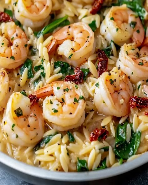 Try this easy Garlic Orzo Tuscan Shrimp recipe with creamy Parmesan sauce, garlic, and spinach. Ready in just 20 minutes for a quick meal! Creamy Shrimp Orzo With Spinach, Garlic Butter Shrimp And Spinach Orzo, Tuscan Shrimp Orzo With Spinach, Garlic Orzo Tuscan Shrimp, Shrimp Orzo Asparagus Recipes, Tuscan Shrimp Orzo, Orzo And Shrimp Recipes, Orzo Shrimp Recipes, Shrimp And Orzo Recipes