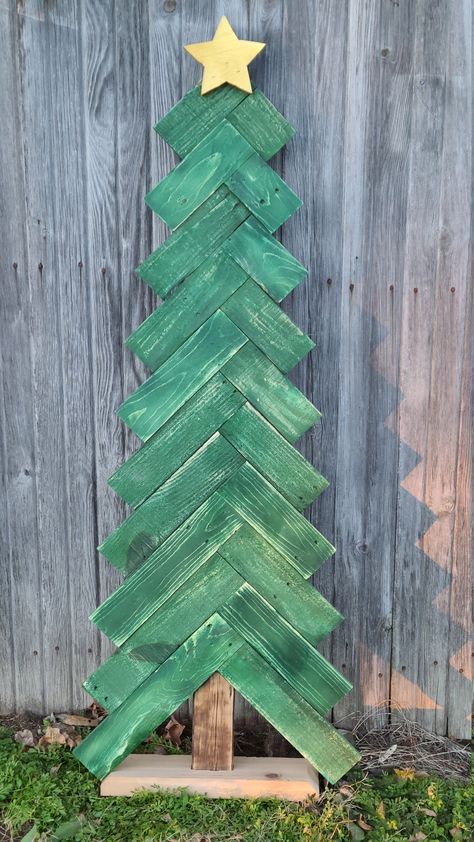 Beautiful rustic Christmas trees made with reclaimed lumber.