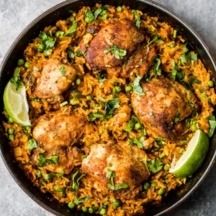 Mama's Puerto Rican Chicken and Rice also known as Arroz con Pollo. This one pan dinner is made with homemade adobo seasoned chicken, sofrito and savory rice. You'll make this recipe again and again! #arrozconpollo #chickendinner #chickenrecipe #skilletdinner #dinnerideas #healthydinner Chicken Sofrito, Puerto Rican Chicken And Rice, Puerto Rican Chicken, Pollo Recipe, Savory Rice, Ambitious Kitchen, Seasoned Chicken, One Pan Dinner, Rice Dish