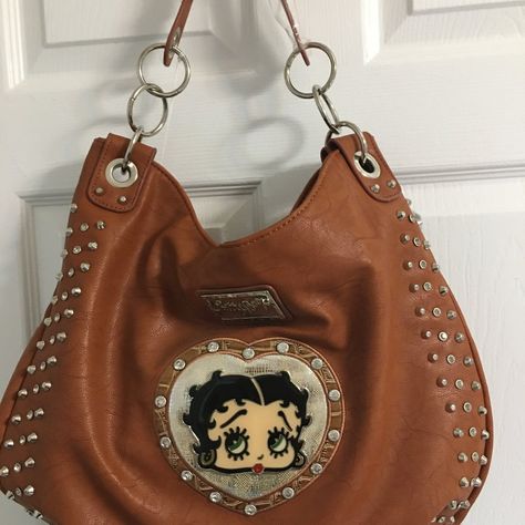 Great Buy On These Well Made, Faux Leather Betty Boop Purses, We Cannot Get More, Left From Our Closed Business, Purse Is So Strong, Weighs A Few Pounds, Great Straps And Compartments, Brown Color This Purse Is Large And Heavy, Probably Weighs Over 2 Pounds Empty. Has A Cross Body Strap And Handles Note: There Is A Matching Wallet Sold Separately - $35 But No Additional Shipping If You Do A Bundle. This Listing Is Just For The Purse Betty Boop Purses, Brown Purses, Garment Bags, Walker Boots, Pretty Bags, Rain And Snow Boots, Betty Boop, Trending Accessories, Laptop Bag