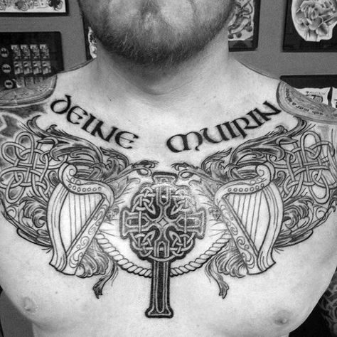 Upper Chest Irish Celtic Cross With Harp Tattoo On Guy Celtic Chest Tattoo, Cross Chest Tattoo, Celtic Cross Tattoo For Men, Harp Tattoo, Gaelic Tattoo, Celtic Cross Tattoo, Cross Tattoos For Men, Celtic Tattoos For Men, Irish Tattoo