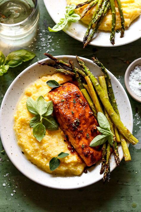 That honey butter polenta, though. A luscious and fast one-pan meal with sweet and spicy bbq salmon roasted alongside tender asparagus. Great for busy or lazy nights! Salmon With Polenta, Salmon Polenta, Salmon And Polenta Recipe, Honey Bbq Salmon, Roasted Sweet Potato Fries, Salmon Roasted, Tender Asparagus, Bbq Salmon, Honey Mustard Salmon