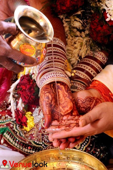 The most important and sentimental ritual of the wedding ceremony is Kanyadaan. From the age-old, it is believed that the bride is given by the parents to the groom, as daan and according, to the Vedic traditions Kanyadaan is considered as the biggest achievement. Father of the bride, requests the groom through Vedic mantras to take care of his daughter and the groom accepts the bride’s hand promising to treat her as his utmost love. Kanyadaan Photography, Sindoor Moment, Mehendi Photography, Indian Wedding Pictures, Punjabi Weddings, Wedding Photography Bridal Party, Wedding Photography Checklist, Indian Wedding Poses, Marriage Photography