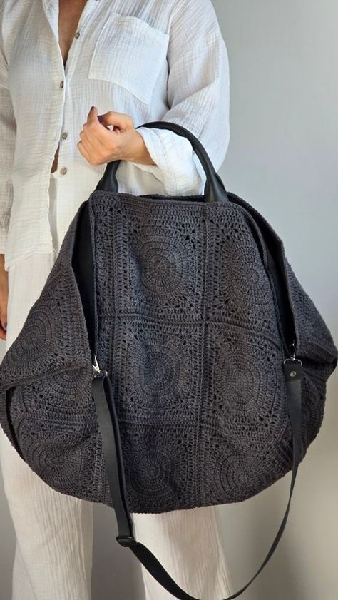 XL Vintage Weekender Crochet Tote Bag In Anthracite, Huge Crochet Duffle Bag Experience the perfect Weekend Bag with dimensions of 76 x 47 x 47 cm , featuring a genuine leather handle for comfort and a secure metal closure to keep the contents intact. Its spacious interior, complemented by transforming it into a stylish oversized regular bag. The bag includes a generous inner pocket.A must-have for lovers of large, vintage-inspired bags 🌱 Regular Version: Stable lining is used to maintain the s Crochet Duffle Bag, Huge Crochet, Oversized Tote Bag, Oversized Bag, Oversized Tote, Crochet Tote Bag, Weekend Bag, Crochet Tote, Big Bags