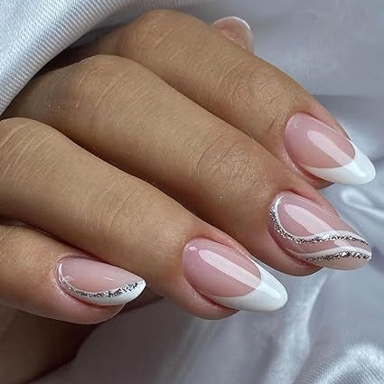 Hey there, gorgeous! 😍 Get your hands on our sassy French Tip Press On Nails. 🇫🇷💅 Rock that cute and classy look with these Almond White Fake Nails featuring Silver Curve Glue Ons. 💎 Ideal for all the lovely ladies out there, they're just perfect for any occasion - be it weddings or birthdays. 🎉 No need for acrylic gel, just stick 'em on and you're good to go! 🚀 Acrylic Nails Almond Wedding, Silver Nail Designs For Wedding, French And Silver Nails, White French Tip Nails With Silver, Silver And White French Tip Nails, Nails With Silver French Tip, French Nail Art Designs Classy, Winter Nail Ideas Acrylic Almond, Silver And White Acrylic Nails