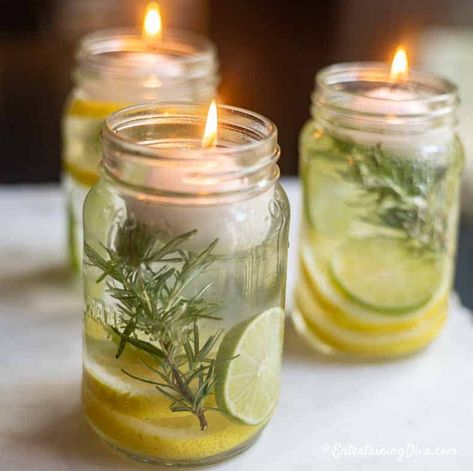 Love to entertain outdoors but don't like to get eaten alive? These DIY Citronella candles act like a mosquito repellent, look really pretty and are very easy to make. Diy Citronella Candles, Mason Jar Citronella Candles, Candle Placement, Diy Citronella, Ostrich Feather Centerpieces, Citronella Candle, Blue Candle Holders, White Table Settings, Citronella Essential Oil