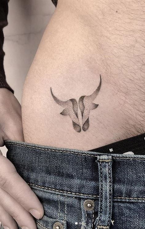 Small Taurus Tattoo For Guys, Back Tattoo Taurus, Taurus Symbol Tattoo Men, Taurus And Scorpio Tattoo Together, Bull Tattoo Feminine Taurus, Taurus Spine Tattoo, Ox Tattoo Design, Taurus Back Tattoo, Geometric Tattoo Taurus