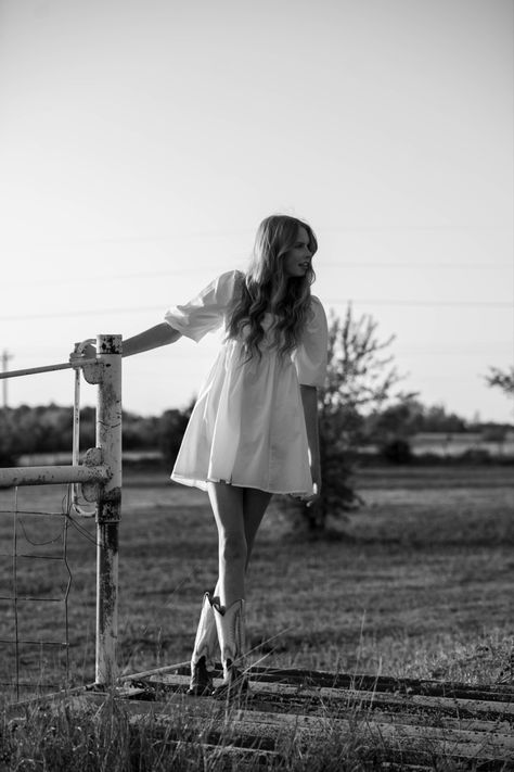 white dress and cowboy boots Dress And Cowboy Boots Photoshoot, Wedding Reception Dress With Cowgirl Boots, Cowboy Boot Senior Pictures, Cute Photos Ideas Instagram, Short Wedding Dress Cowboy Boots, Weird Photo Shoot Ideas, Senior Picture Ideas Black And White, White Dress With Cowboy Boots Senior Photos, White Dress And Cowgirl Boots