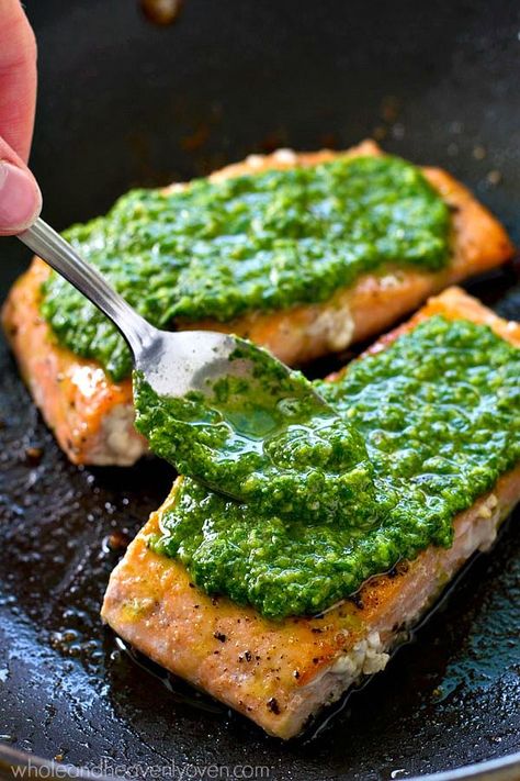 Simple pan-seared salmon is smothered in a flavorful spinach basil pesto sauce for a healthier dinner you can have ready in under 15 minutes. --- Serve this salmon with a green salad and you've got dinner done! Salmon Recipe Pan, Roasted New Potatoes, Salmon With Spinach, Spinach Basil Pesto, Salmon Recipes Pan Seared, Basil Pesto Sauce, Salmon Spinach, Pesto Salmon, New Potatoes