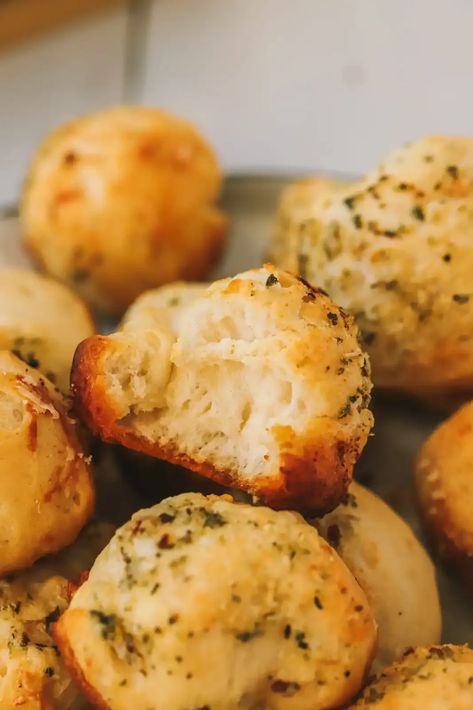 These easy garlic bread bites are the perfect appetizer! Butter, spices, parmesan cheese and biscuit dough - your guests will love these! Garlic Bread Bites, Garlic Cheese Bites, Garlic Parmesan Bread Bites, Garlic Parmesan Biscuit Bites, Dominos Parmesan Bread Bites, Garlic Bread Ritz Bits, Pilsbury Biscuit Garlic Butter Cheese, Parmesan Bread Bites, Bread Bites Recipe