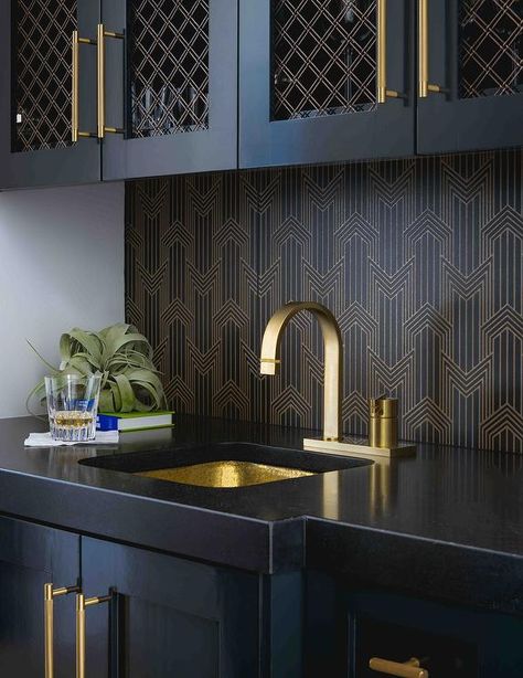 Black wet bar designed with a gold and black backsplash, black quartz countertops, and black cabinets with long brass pulls. Black Wet Bar, Wet Bar Cabinets, Black Quartz Countertops, Wet Bar Sink, Wet Bar Designs, Home Wet Bar, Black Backsplash, Home Bar Rooms, Basement Bar Designs