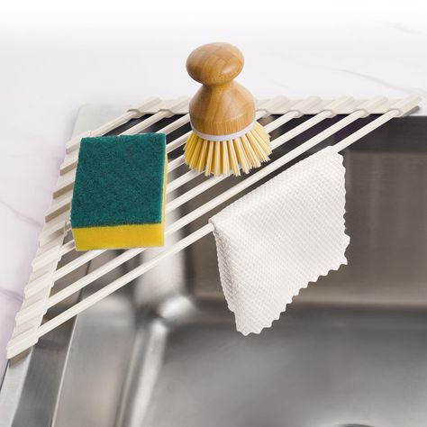 PRICES MAY VARY. ✅【Upgraded Triangle Roll-Up Dish Drying Rack】The outermost silicone edge of this triangular roll-up dish drying rack has been lengthened, and the stainless-steel tubes are not easy to fall out with the reinforcement. ✅【Small Size】This triangular shape rack will make full use of your kitchen sink corner space. Designed for maximum stacking capacity to efficiently dry dishes with proper drainage and ventilation. Dimensions: 16.1"D x 6.3"W x 0.39"H. Important: Please measure your s Sink Drying Rack, Dish Drying Rack, Sink Sizes, Space Saving Kitchen, Sink Kitchen, Over Sink, Shelf Holders, Corner Sink, Corner Storage