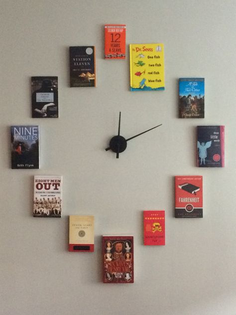 My book clock! Each book features a number in the title to represent the numbers on the clock. Bookstore Decor Ideas, Coach Office Decor, Hanging Books, Book Wall Decor, School Library Displays, Book Clock, Book Furniture, Bookstore Cafe, Book Wall Art