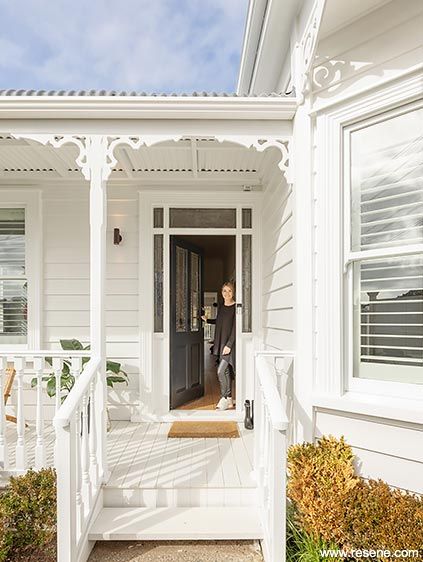 Annick and Tim's 1901 villa looks tidy and handsome with weatherboards in Resene Sea Fog trimmed with Resene Alabaster and a roof in Resene New Denim Blue. The porch is in slightly deeper Resene Triple Sea Fog while the front door makes a statement in Resene Blue Bark. Antique White Usa, Resene Colours, City Houses, White Exterior Paint, White Exterior Houses, Exterior House Color, Cottage Exterior, Auckland City, Exterior Trim