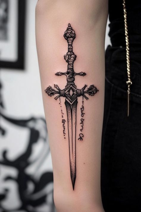 Sword tattoo with intricate details on a person's arm. Dagger Forearm Tattoo, Dagger Tattoo Women, Dagger Tattoo Ideas, Dagger Tattoo Design, Dagger Tattoos, Traditional Dagger, Vintage Tattoo Art, Camera Tattoos, Jewel Tattoo