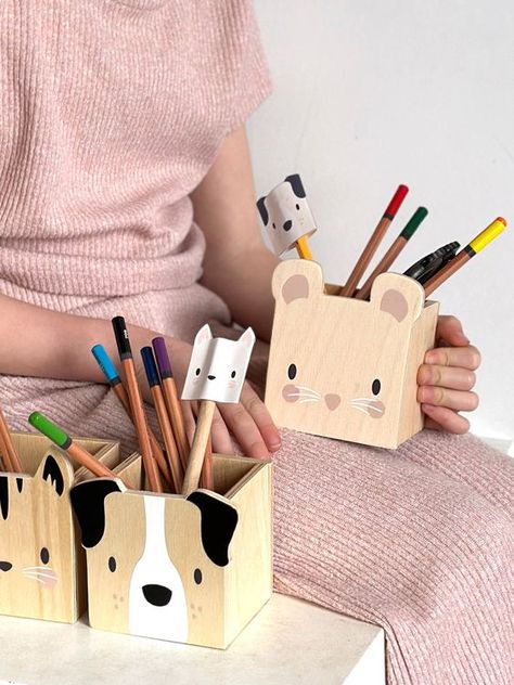 Pet Themed Pencil Holders by Tender Leaf Toys A set of wooden pencil pots to use as organisers for your child creative or work space. Illustrated with a friendly Cat, Dog and Mouse faces. Great along side our Desk and Chair, and a lovely characteristic addition to the nursery. Presented in an illustrated colour box Suitable for ages 3+ Product dimensions: 26.6 x 8 x 10 cms Click on the link below for a free crafty activity! Wooden Pencil Holder, Wood Pencil Holder, Making Wooden Toys, Pencil Holders, Wood Projects For Beginners, Desk And Chair, Wooden Pencil, Wooden Dog, Desk Tidy