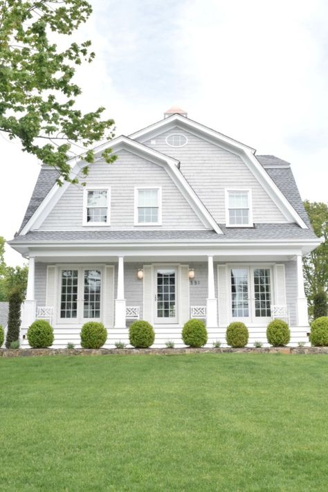 Varying shades of gray, blue, and white are recent home exterior trends. This gorgeous New England home features varying shades of gray and white for a chic exterior look. View other New England home exterior ideas to find one that fits your dream home. Gray House With White Trim, New England Homes Exterior, House With White Trim, Outdoor Paint Colors, Best Exterior Paint, Gray House, Homes Exterior, Homes Ideas, England Homes