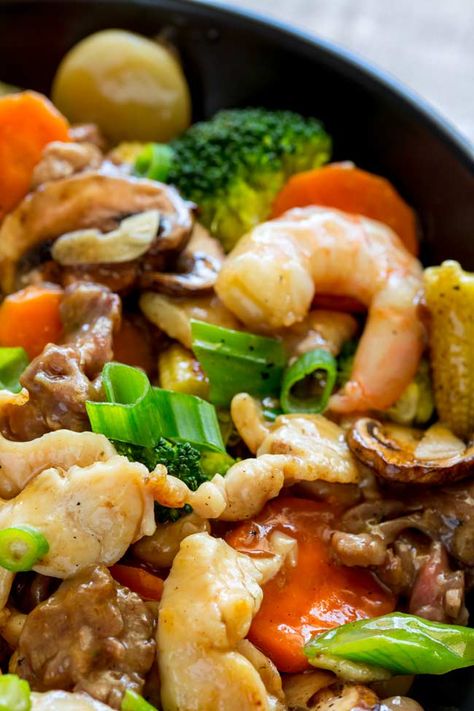 This Happy Family Stir Fry recipe is a wonderful combination of beef, chicken and shrimp, all cooked in one pot with fresh veggies and a Chinese sauce. It is easy to make at home and tastes so much better than a takeout. Paired with steamed rice it is a healthy weeknight meal.  #Chinese #takeout #stirfry #easyrecipe #easydinner  #chineserecipe #takeout #simpledinner Happy Family Chinese Recipe, Shrimp Asian, Happy Family Recipe, Chinese Sauce, Homemade Chinese Food, Asian Stir Fry, Chinese Cooking Wine, Chinese Cooking Recipes, Chinese Takeout