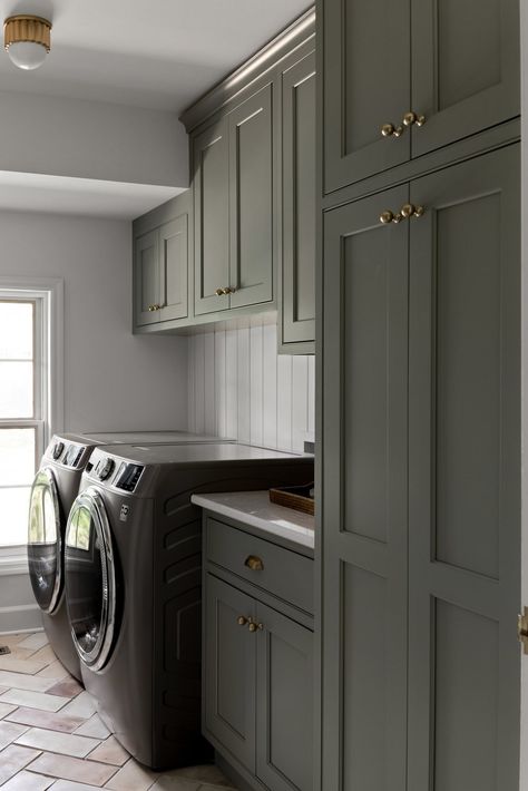 We love a warm laundry room! This authentic laundry space features charming herringbone floors and custom cabinets - all by Hannesson Home Interiors. We’re a full service design firm in Billings, Montana. Servicing the greater Yellowstone area, including Boise, Idaho Falls, Whitefish and Pocatello. Room Cabinet Design, Closet Design Plans, Laundry Room Appliances, Cottage Laundry Room, Laundry Room Paint Color, Laundry Room Cabinet, Interior Deisgn, Green Laundry, Laundry Space