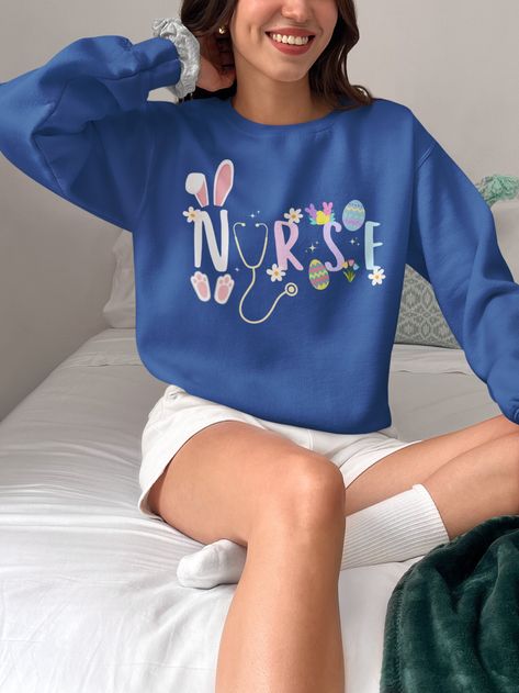 🐰 Celebrate Easter in Cozy Comfort with Our Nurse Easter Crewneck Sweatshirt! 🌷 Add a touch of Easter cheer to your wardrobe with our Nurse Easter Crewneck Sweatshirt! Crafted from a luxurious blend of polyester and cotton, this sweatshirt offers pure comfort in any situation while showcasing a delightful Easter-themed design that will brighten your day. Sizing: look at the chart in photos for more details, they are unisex.  🌼 Premium Quality Craftsmanship 🌸 Our crewneck sweatshirt is made w Nurse Crewneck, Nursing Clothes, Nurse Shirt, Nursing Shirts, Nurse Life, Comforters Cozy, Knit Collar, Easter Gift, Brighten Your Day