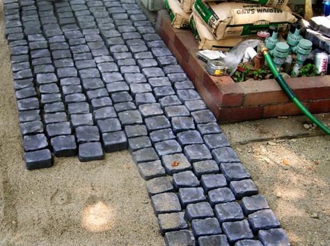 An old concrete patio with a mismatched paver extension gets a completely different look with a stylish cobblestone overlay. Learn how to make it yourself on DIYNetwork.com. Cobblestone Patio, Cobblestone Pavers, Cobblestone Driveway, Diy Garden Patio, Patio Layout, Patio Pavers Design, Concrete Patios, Paver Walkway, Outdoor Patio Designs