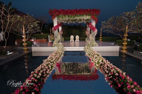 Our ombre floral mandap adds a touch of romance to this picture-perfect pool setting #weddinggoals #floralmandap #poolsidevibes Varmala Backdrop, Varmala Decor, Varmala Ideas, Shadi Decoration, Mandap Ideas, Stage Decoration Photos, Floral Mandap, Shaadi Decor, Royal Indian Wedding