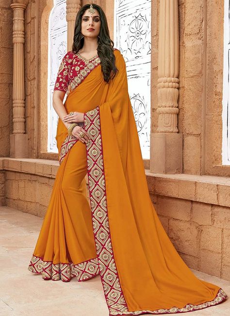 Yellow and Red Embroidered Silk Saree features a nylon silk saree alongside a velvet blouse. Embroidery work is completed with zari, thread and stone embellishments. Mustard Yellow Saree, Green Sarees, Bollywood Sarees Online, Border Art, Satin Silk Saree, Silk Sarees With Price, Indian Designer Sarees, Latest Indian Saree, Shilpa Shetty