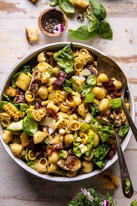 223 reviews · 45 minutes · Serves 8Pesto Chicken, Corn, and Avocado Bacon Pasta Salad | halfbakedharvest.com by Half Baked Harvest Charcuterie Pasta Salad, Outdoor Dinner Outfit, Half Baked Harvest Pesto, Pasta Salad Half Baked Harvest, Quick Easy Summer Meals, Pesto Chicken Pasta Salad, Protein Pasta Salad, Spring Dinners, Veggies Dinner