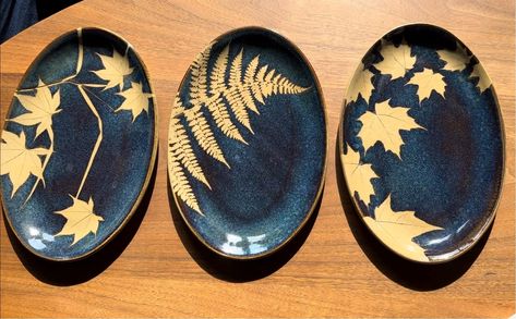 10.5" x 7" Oval Plates or platters, stoneware, marked Kaleidoscope Pottery on the back. These appear to be vintage and are no longer available from the potter in Easthampton, MA, however they do not have a date stamp and are not attributable at a specific timeframe. Hand Painted Pottery Plates, Amaco Obsidian, Pottery Plates Handmade, Oval Trinket Tray, Plates Handmade, Pottery Patterns, Pottery Platter, Date Stamp, Leaf Stencil