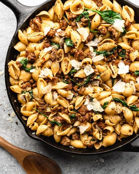 Creamy shell pasta is surrounded by browned crispy sausage, colorful spinach, and delicious pecorino cheese Sausage And Shells, Crispy Sausage, Apple Gouda, Ground Sausage Recipes, Shell Pasta, Sausage Pasta Recipes, Italian Sausage Pasta, Mild Italian Sausage, Easy Pasta Dishes