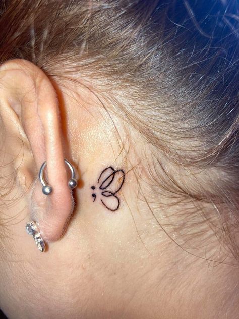 Tattos On The Back Of The Ear For Women, Dainty Tattoo Behind Ear, Semi-colon Butterfly Tattoo Behind The Ear, Behind The Ear Semi Colon, Behind The Ear Tattoo Ideas Semicolon, Small Behind The Ear Tattoo Ideas Women, Semi-colon Tattoo Angel Wings, Apostrophe Tattoo, Butterfly Semi Colon Tattoos For Women