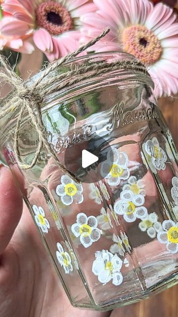 🌿Anna☀️| Crafts, Play & Learning on Instagram: "Painted Daisy Jars 🌸  I upgraded a couple of my paintbrush jars with some painted q-tip daisies and forget-me-nots!   I am not very good at painting on anything that isn't flat but this technique helps you achieve a lovely look really easily ..just what I like 🤣 I even decorated a teeny jam jar (I'll share in stories!)  Have you tried painting your own? I have seen some absolutely beautiful little masterpieces!   Which is your favourite; the daisies or the forget-me-nots? 💠 I love them both!!  #glassjars #paintingjars #jarpainting #diycrafts #paintingflowers #cottonbudpainting #jardecoration #decoratingjars #flowercraft #flowerartist #summercrafts #forgetmenot #daisyart #daisyflower #craftflowers   #finemotorskills #simpledesign #simplear Jam Jar Crafts, Jar Painting, Anna Craft, Painted Daisy, Q Tip Painting, Daisy Art, Flower Artists, Jar Design, Daisy Painting