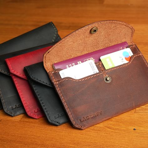 Elevate your travel experience with the Läderfy Genuine Leather Passport Wallet. 
Keep your ticket, ID cards, and important documents together while displaying your style and individuality with its quality craftsmanship.
1 passport slot and 2 card pockets offer practicality and organization.
It was produced in 5 different color options to appeal to every style.

Worldwide express shipping🌍👉🏼etsy.com/shop/laderfy/ Passport Cover Aesthetic, Cover Aesthetic, Leather Passport Wallet, Important Documents, Handmade Leather Wallet, Passport Wallet, Travel In Style, Passport Cover, Handmade Leather