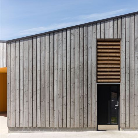 Scottish Larch Cladding used on commercial building on the Isle of Harris Hit And Miss Timber Cladding, Board On Board Cladding, External Timber Cladding, Hit And Miss Cladding, Charred Larch Cladding, Weathered Timber Cladding, Vertical Wooden Cladding Exterior, External Wood Cladding, Larch Cladding Exterior