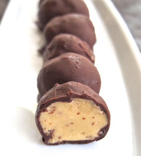 A few natural ingredients make these chocolate covered peanut balls healthier, but an equally enjoyable and protein rich snack or dessert. Lilys Chocolate, Healthy Chocolate Peanut Butter, Healthier Dessert Options, Chocolate Peanut Butter Balls, Peanut Butter Balls Recipe, Protein Rich Snacks, Butter Balls, Frozen Chocolate, Peanut Butter Balls