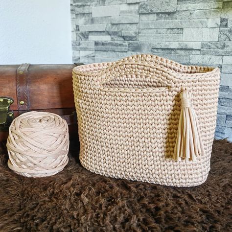 🌿 Introducing my latest creation: a chic crocheted handbag crafted from eco-friendly T-shirt yarn, featuring a sturdy faux leather base and a playful tassel detail. Perfect for those who love sustainable fashion with a touch of flair! No lining needed—this bag is as durable as it is stylish. ♻️👜 #EcoFashion #CrochetLover #sustainablestyle #crochetbag #handmade Crocheted Handbag, Crochet Handbag, Crochet Lovers, T Shirt Yarn, Eco Fashion, Crochet Handbags, Crochet Bag, Sustainable Fashion, Tassels