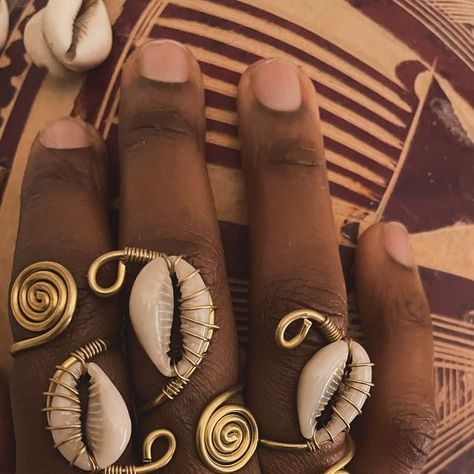 Afrisoul Goddess Cowrie Shell Jewelry on Instagram: "New Product Alert ‼️ I’m in love with these rings… Will be added to the shop tonight. 💜" Shell Rings Diy, Cowry Shell Jewelry, Ghana Nails, Aesthetic Blender, Cowrie Shell Jewelry, Wire Bending, Shell Tattoos, Diy Earrings Easy, New Product Alert